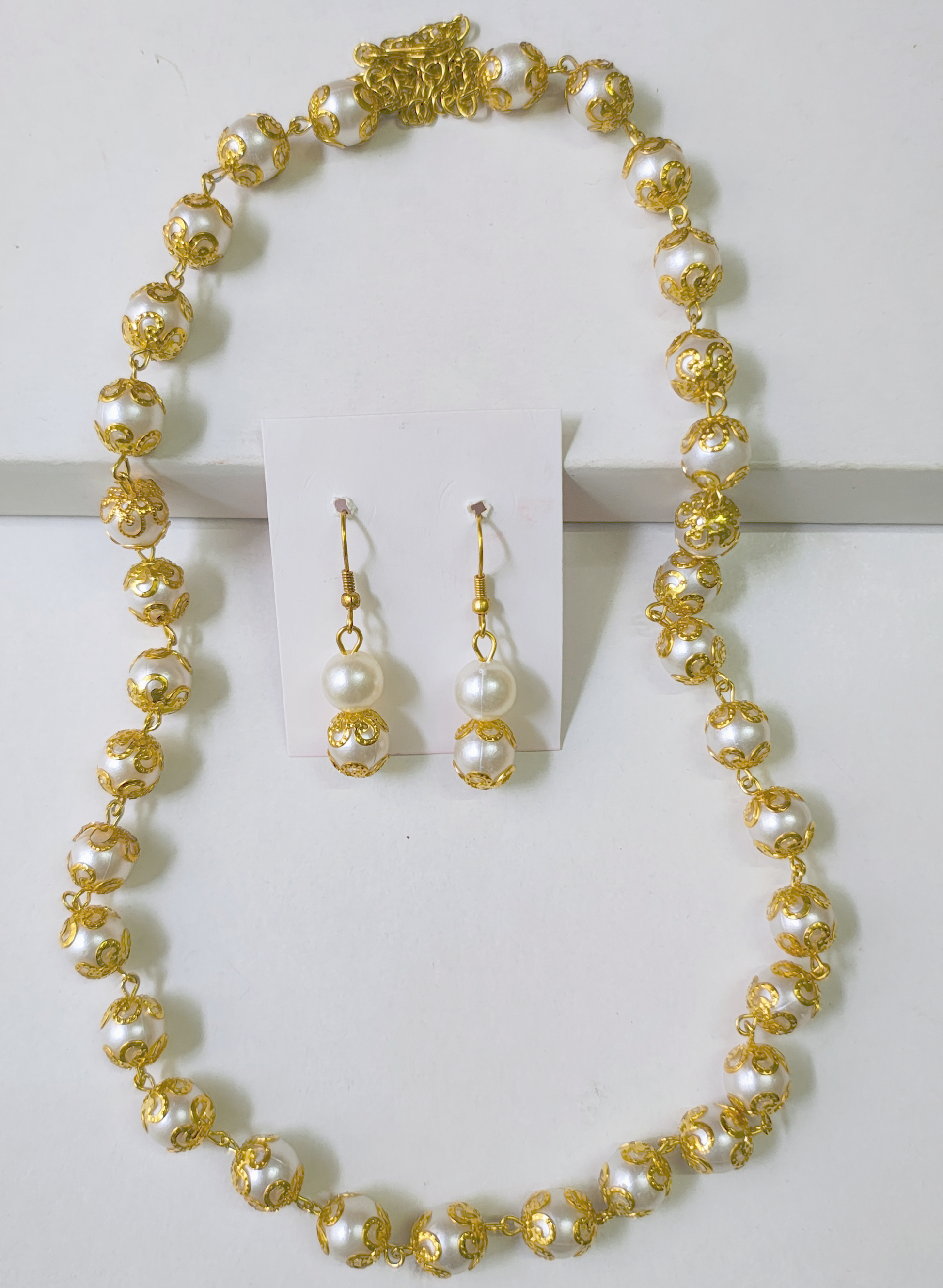 mango-toned necklace
sunset pearl necklace
bold festive accessories
resort jewellery india